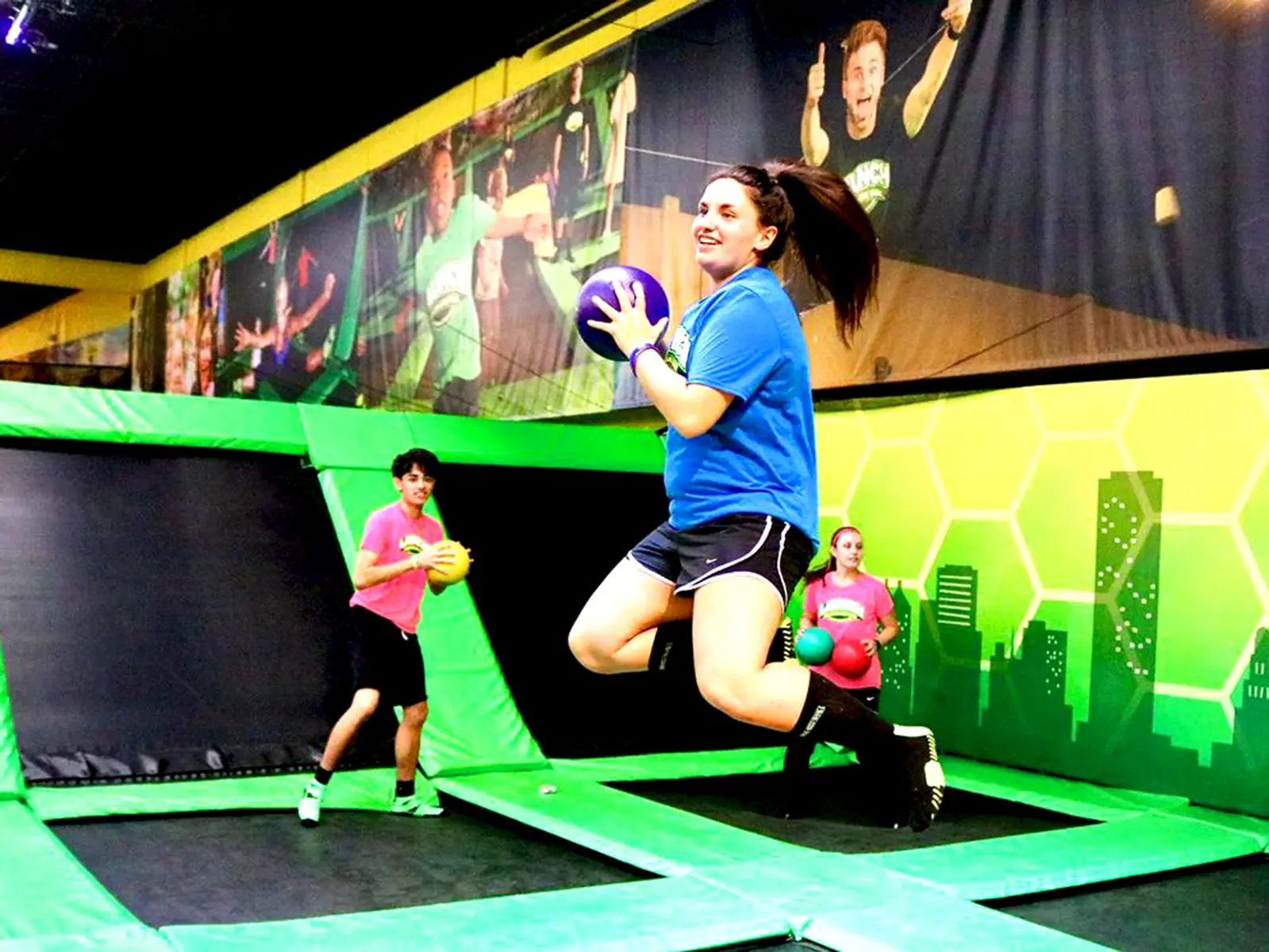 Trampoline park visitor jumping and playing dodgeball in Switzerland